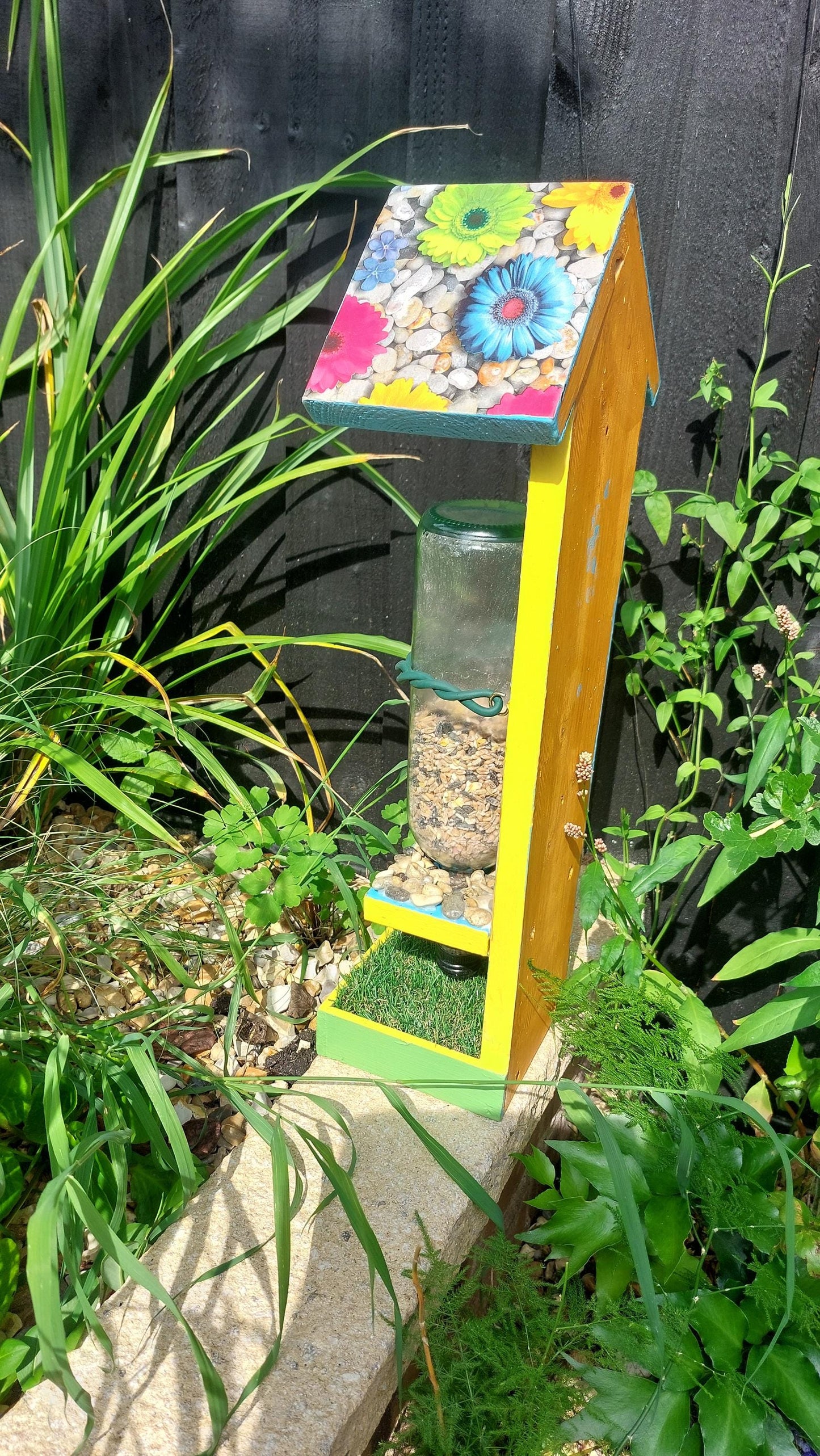 bright colourful bespoke wooden bird feeder