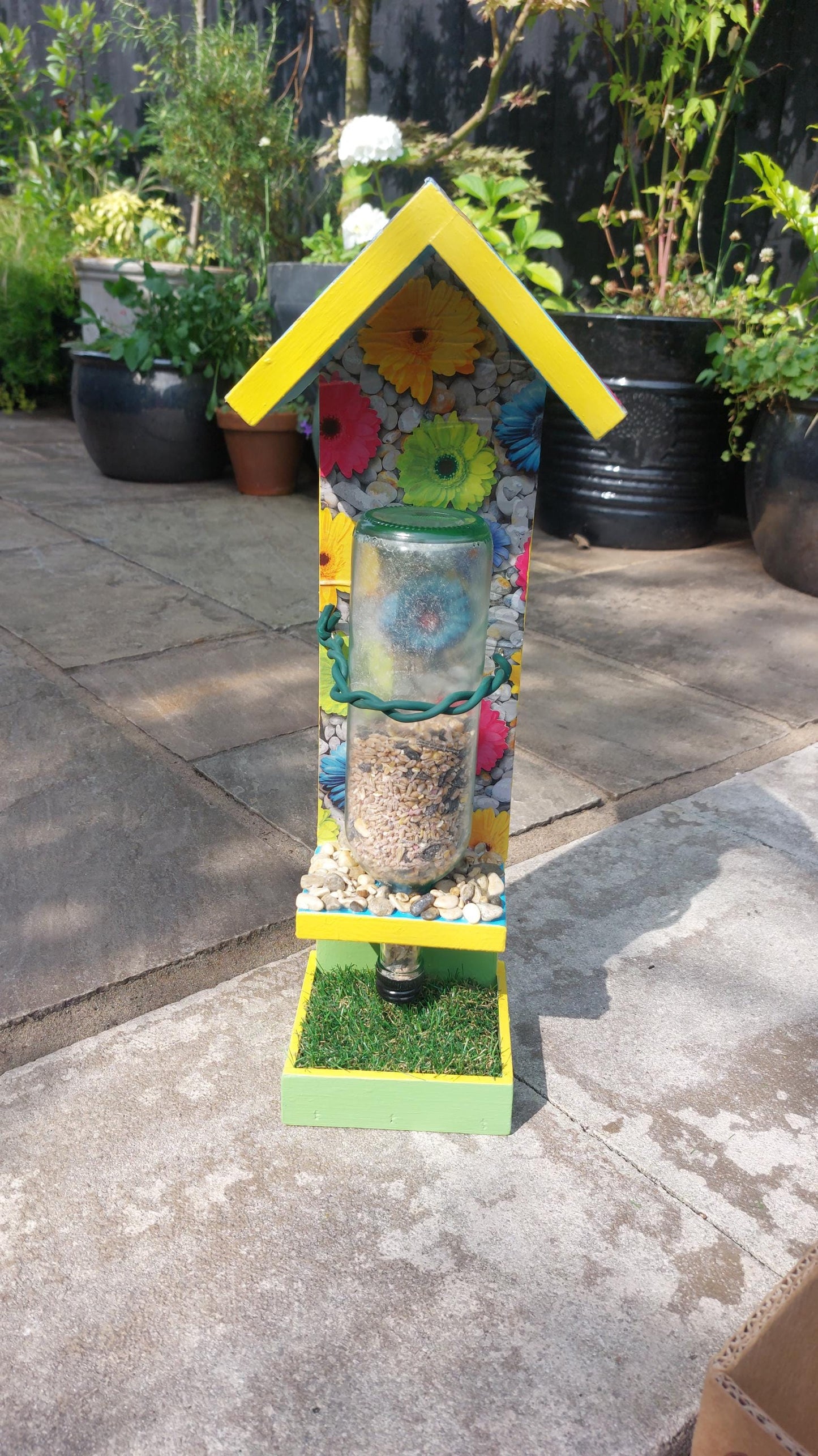 bright colourful bespoke wooden bird feeder